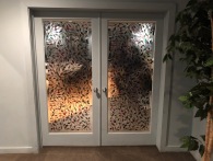 Our beautiful "stained glass" doors separating the large and small meeting rooms